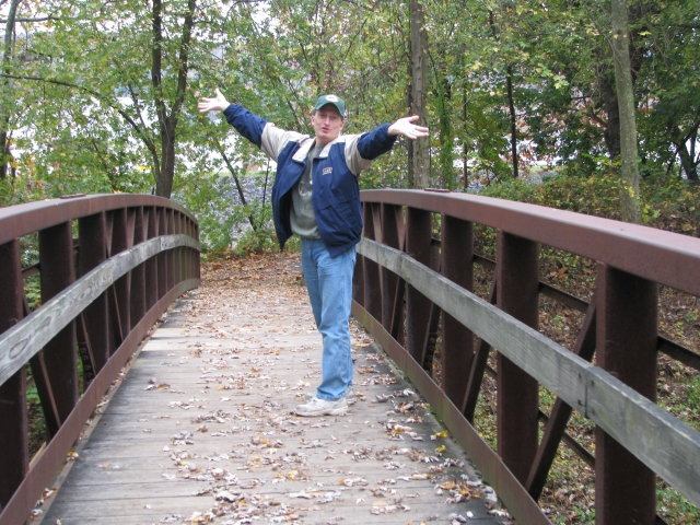 George on the bridge down by towpath across from steel stacks on a fall day.  Taking pics and hiking